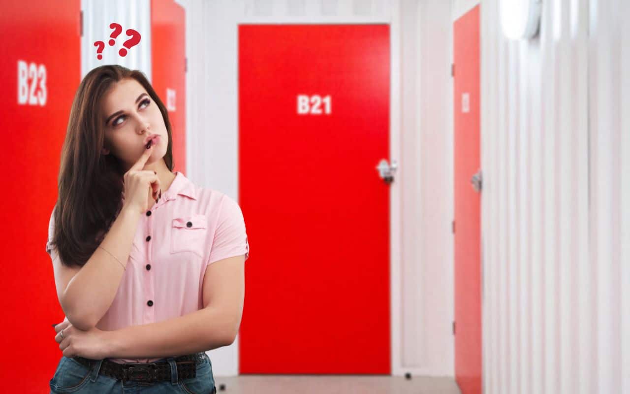 Woman thinking in a self storage facility
